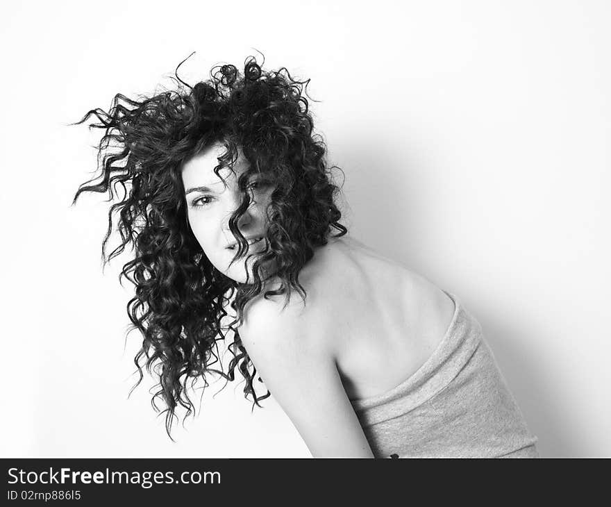 Young woman with curly black hair posing. Young woman with curly black hair posing