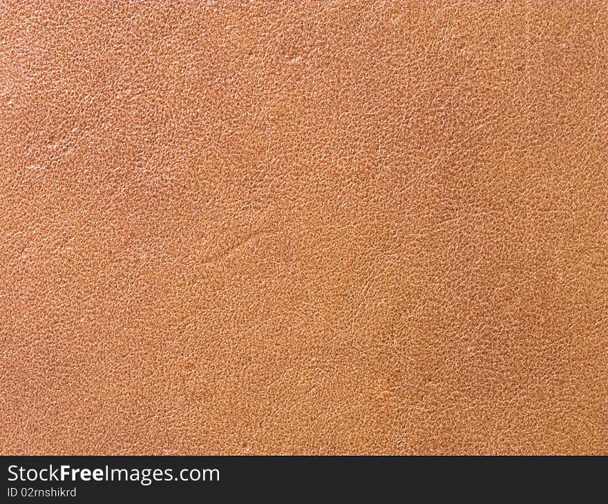 Close Up Of A Closed Book With Leather Brown Cover