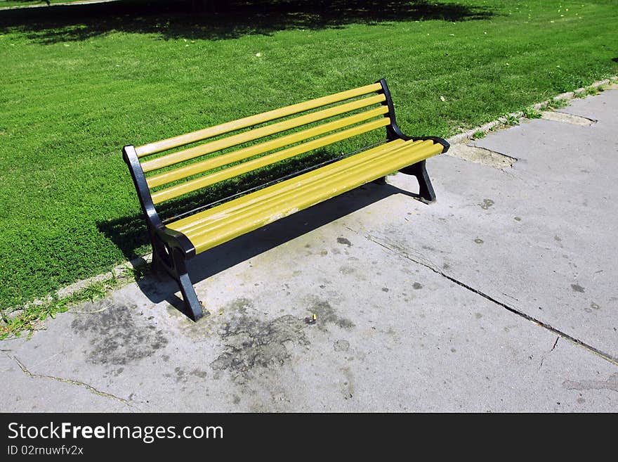 Bench and lamps in tranquil green city park