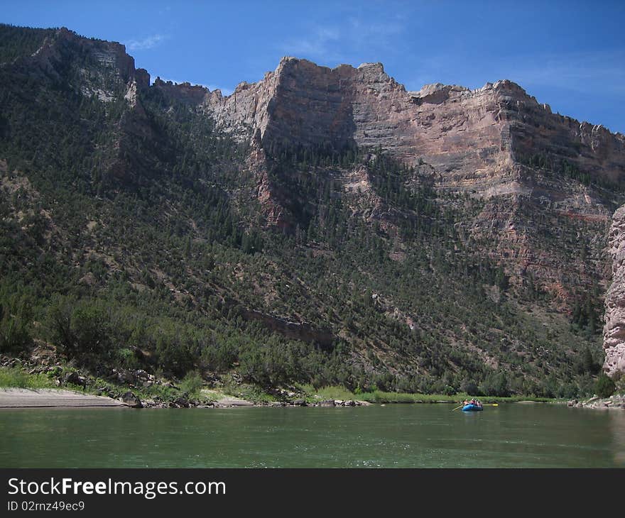 Rafting down a river with immense scenery all around. Rafting down a river with immense scenery all around