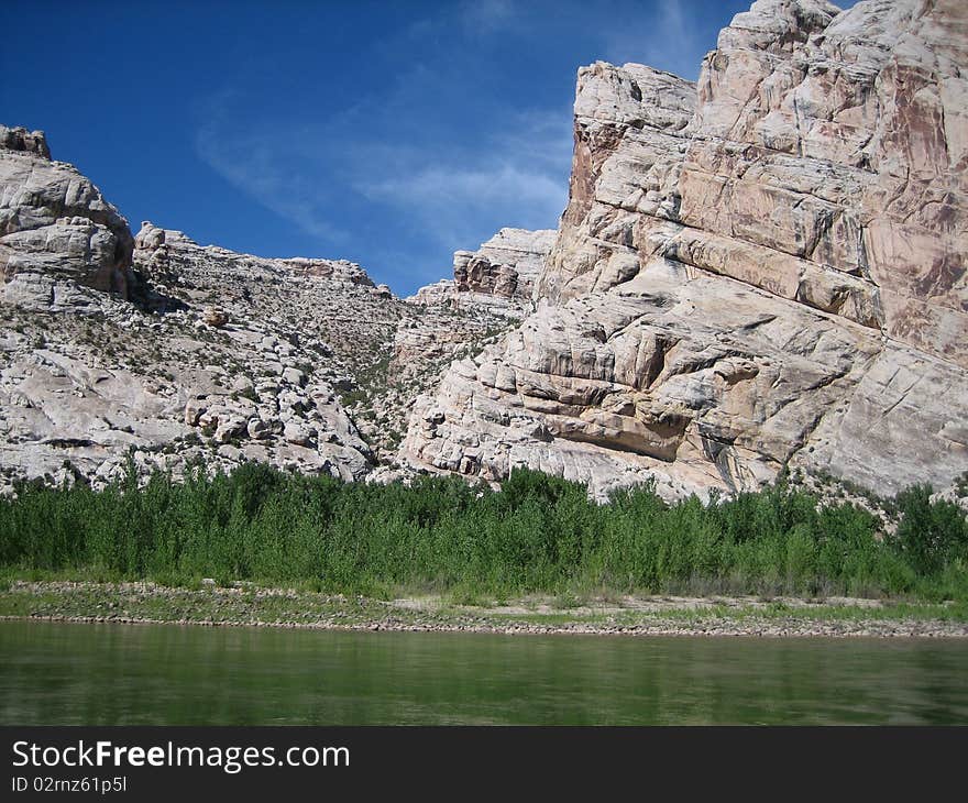 Beautiful sky breaks through the canyon wall on a river. Beautiful sky breaks through the canyon wall on a river