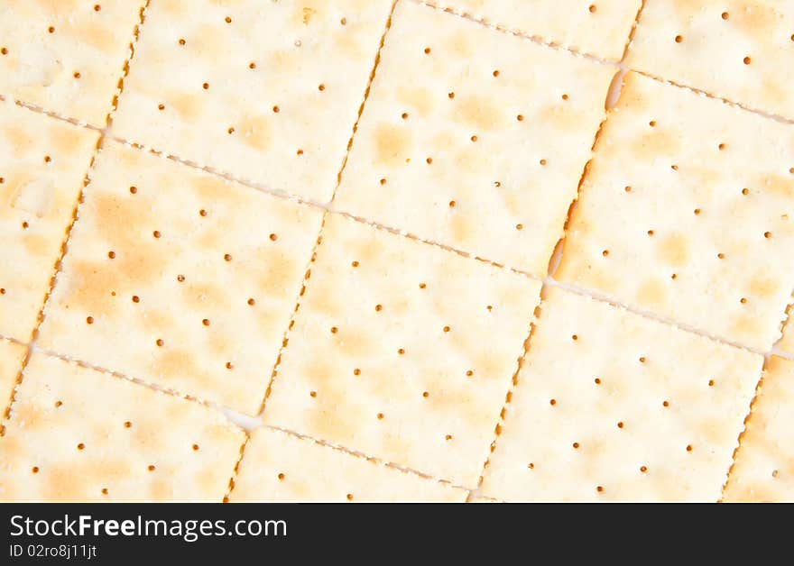 Saltine crackers arranged to create a repeating pattern. Saltine crackers arranged to create a repeating pattern