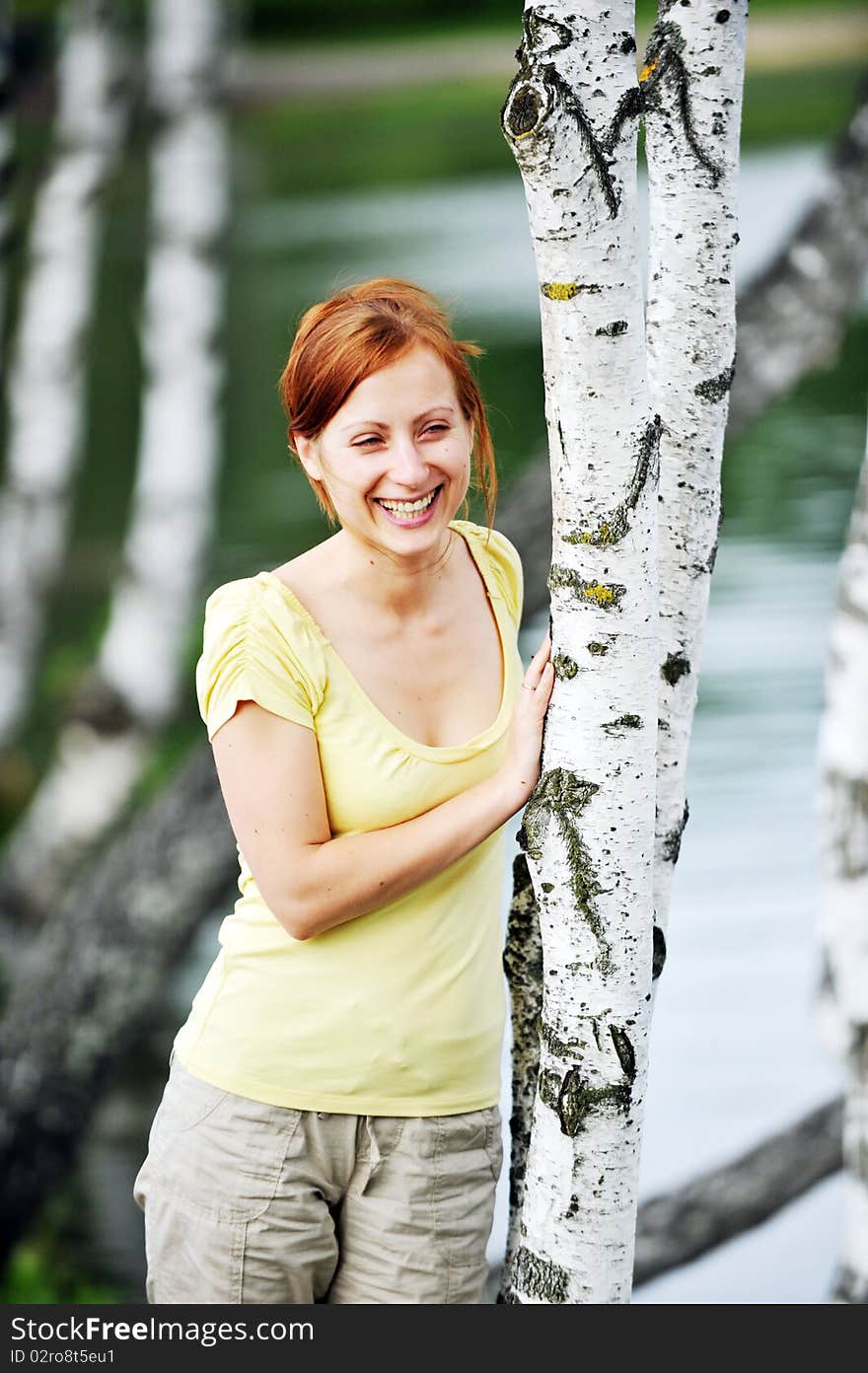 Beautiful young woman in park portrait