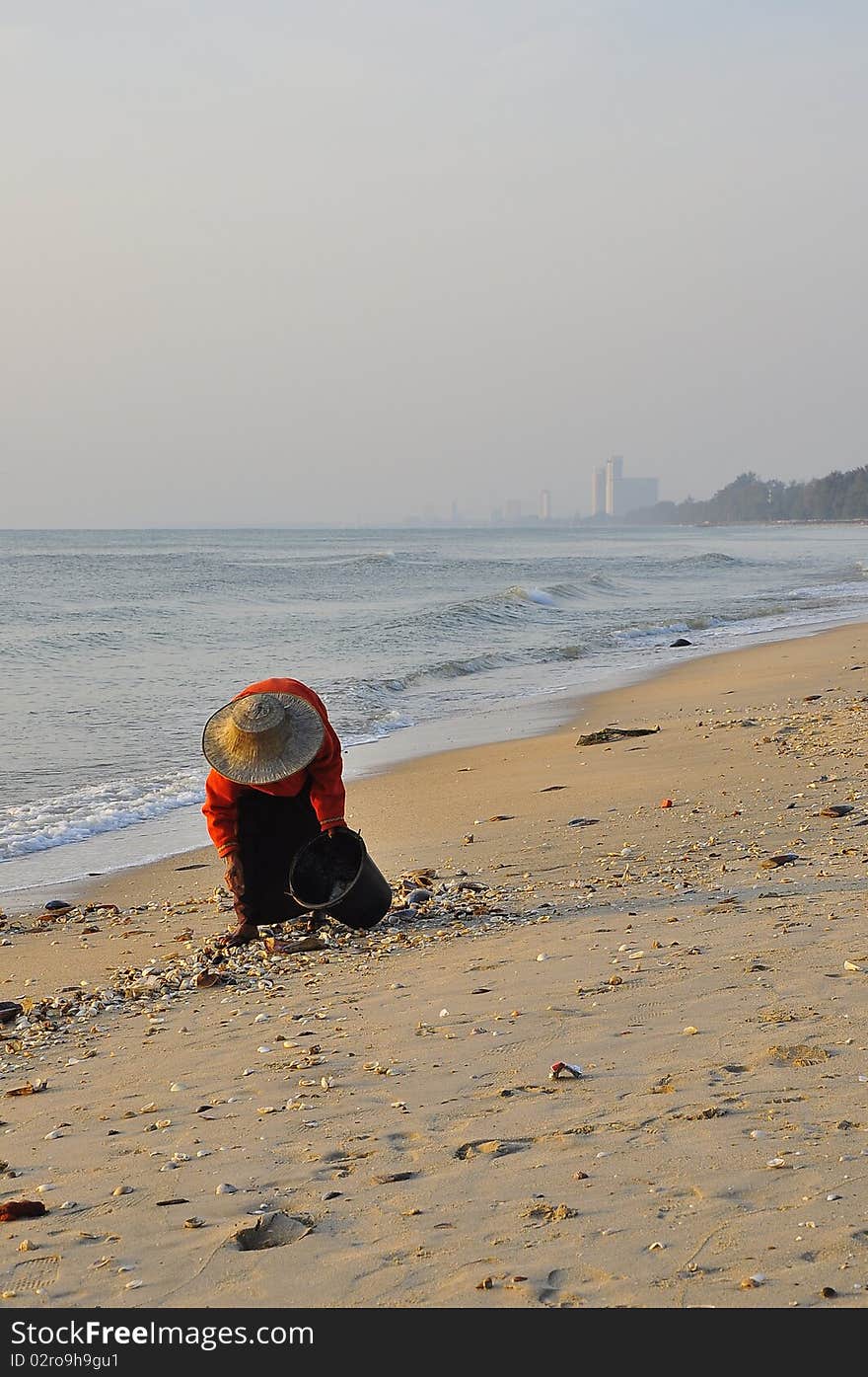 Old woman at Cha-am Beach ,Thailand