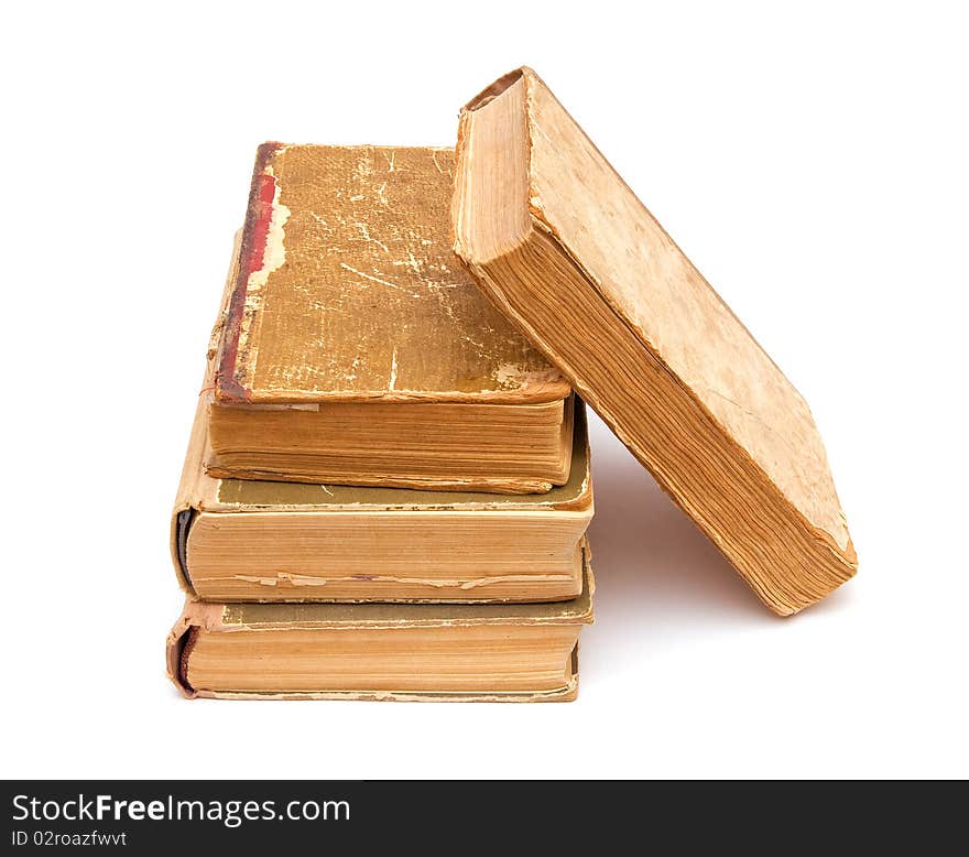 Four old books isolated on white background