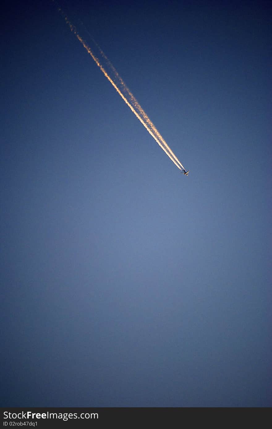 Airplane against blue sky