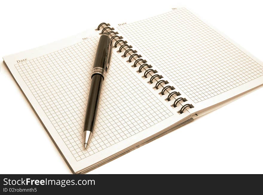 The image of the notepad and pen