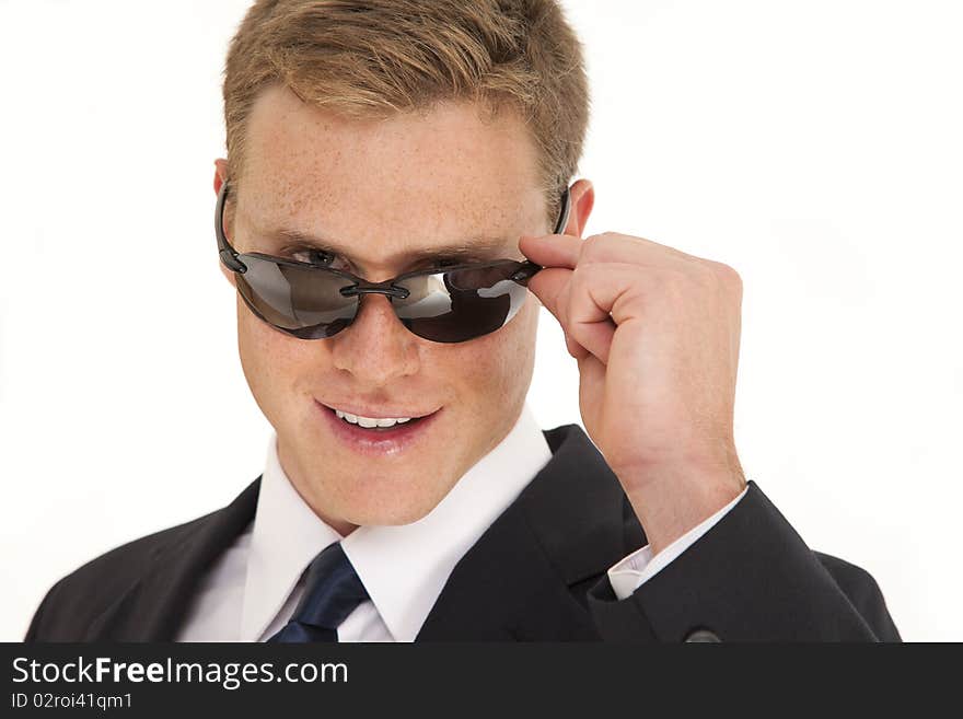 Confident young businessman with sunglasses