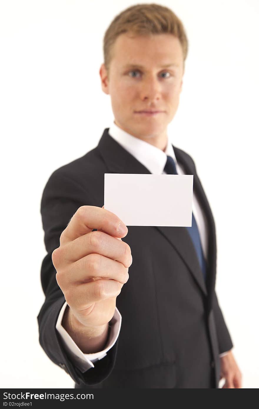 Portrait of businessman showing blank business card to camera