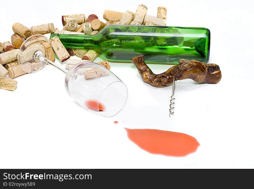 Wine is spilled, the bottle and a glass lie, it is a lot of stoppers. Wine is spilled, the bottle and a glass lie, it is a lot of stoppers