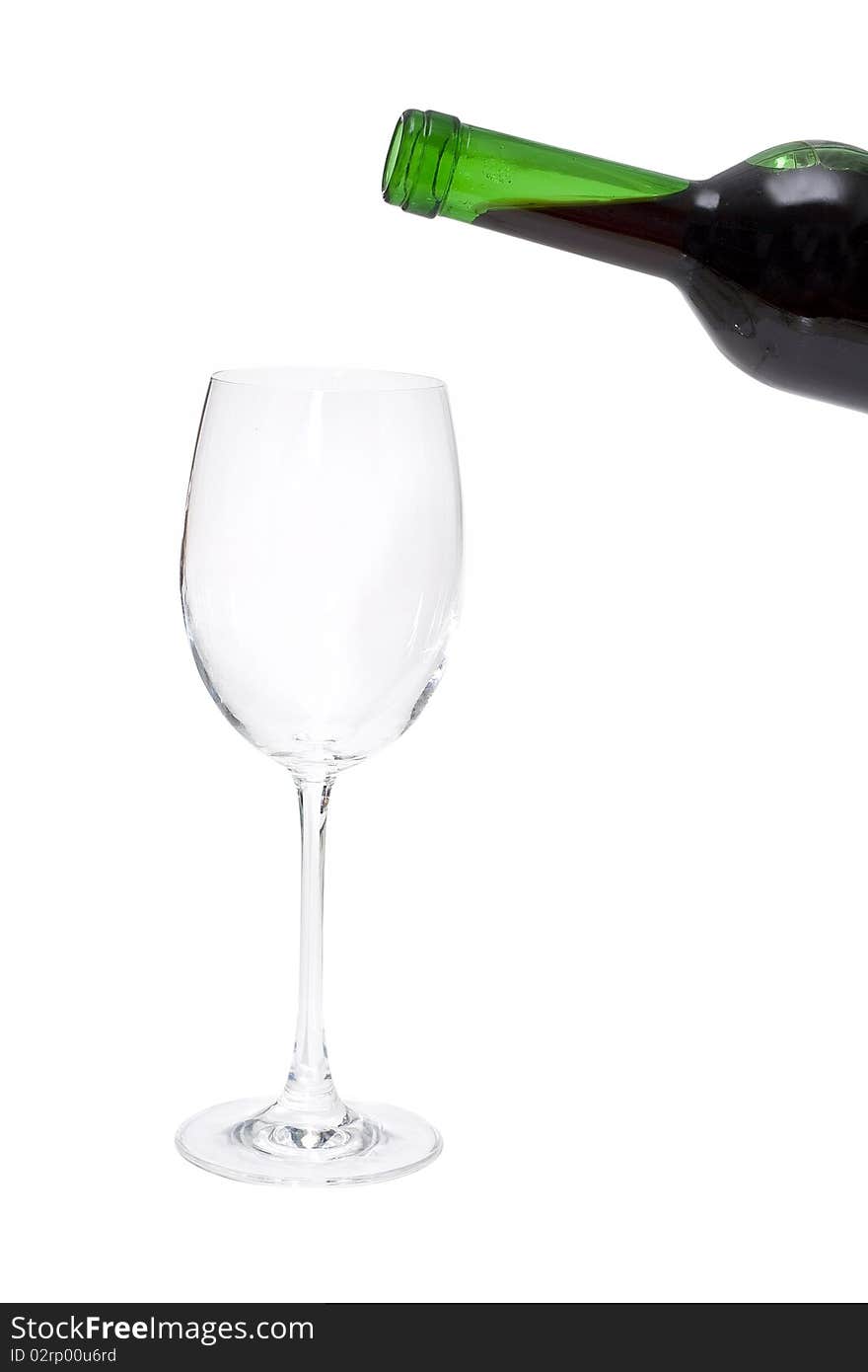 Pour a wine from a bottle in a glass. Pour a wine from a bottle in a glass