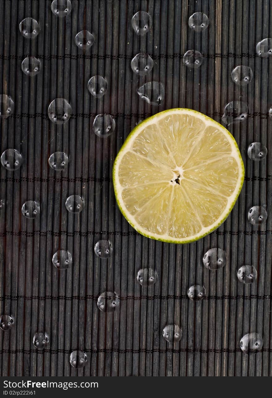 Slice of Lime with Water Drops. Slice of Lime with Water Drops