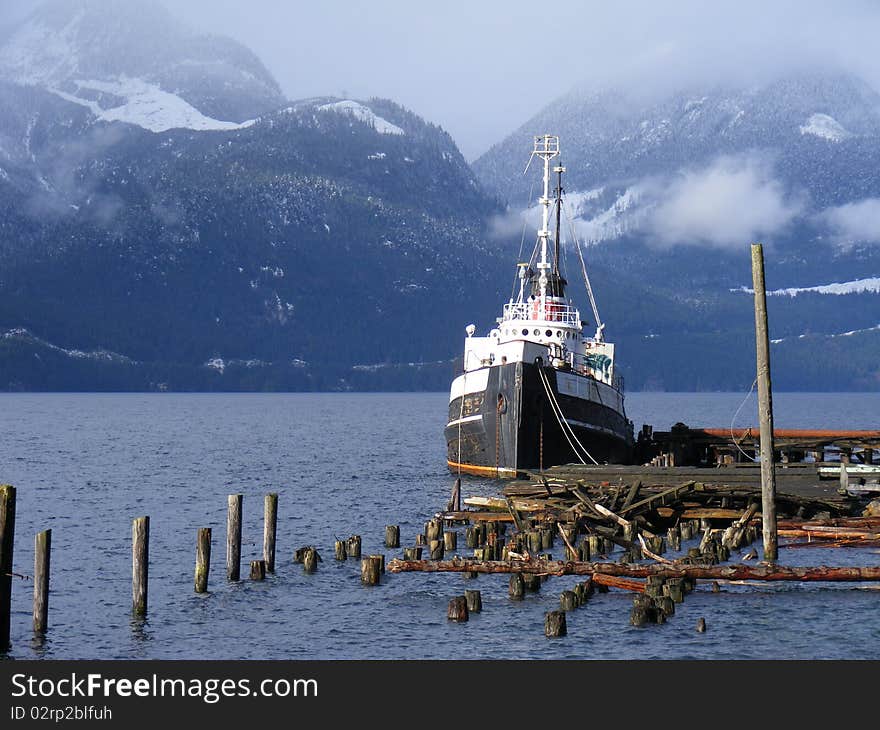 A view of tug boat among mountains, Britannia Beach, Squamish, British Columbia, Canada. A view of tug boat among mountains, Britannia Beach, Squamish, British Columbia, Canada