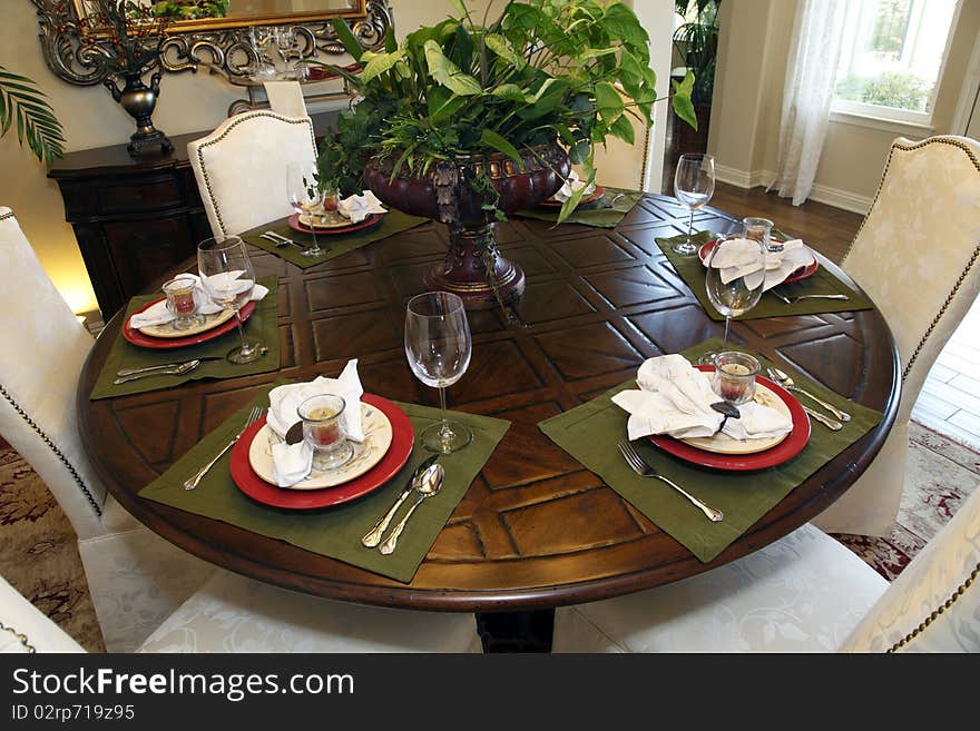 Luxury home dining table with modern tableware. Luxury home dining table with modern tableware.