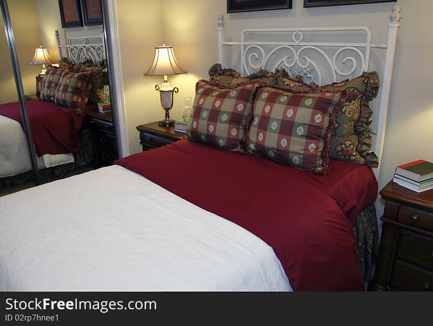 Comfortable modern bedroom with a spacious bed. Comfortable modern bedroom with a spacious bed.