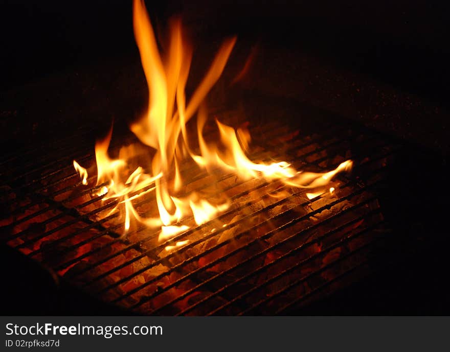 Bonfire background with fire flames and firewood