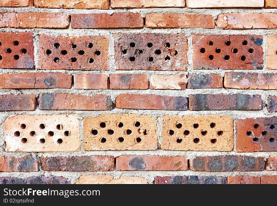 Weathered stained old red brick wall background