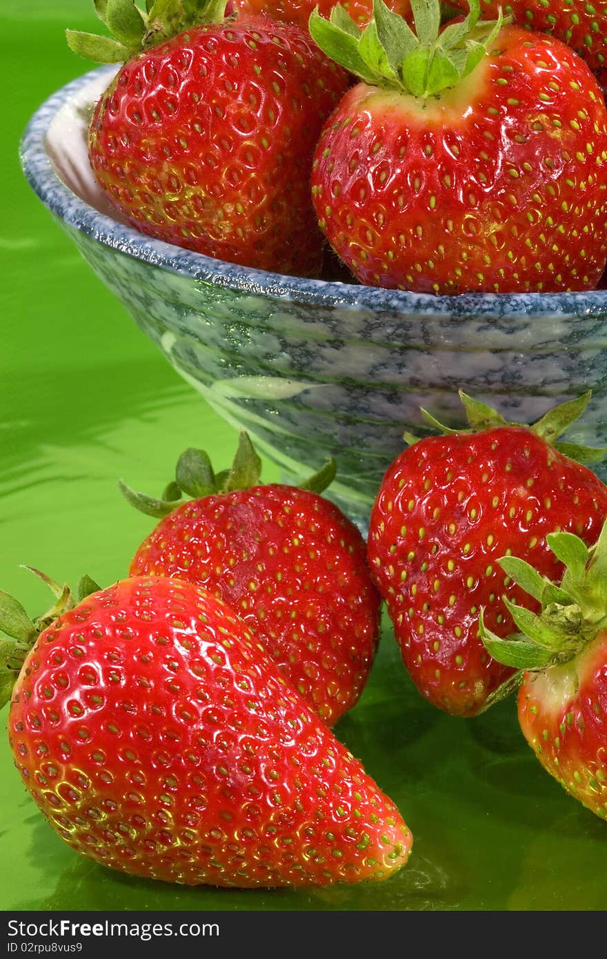 Close up of strawberries in a bowl.