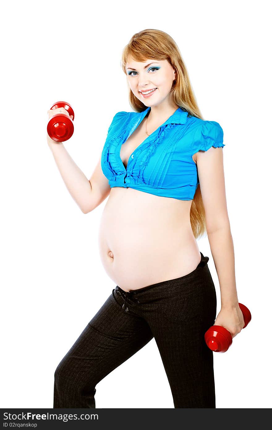 Portrait of pregnant woman training with dumbbells. Isolated over white background. Portrait of pregnant woman training with dumbbells. Isolated over white background.