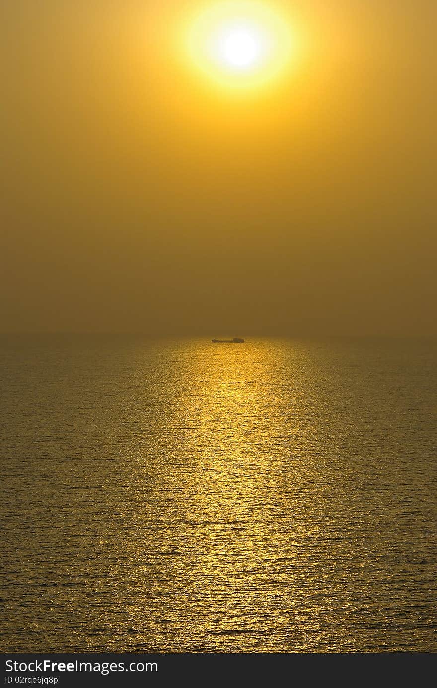 It is sunset on the sea in yellow color. It is sunset on the sea in yellow color