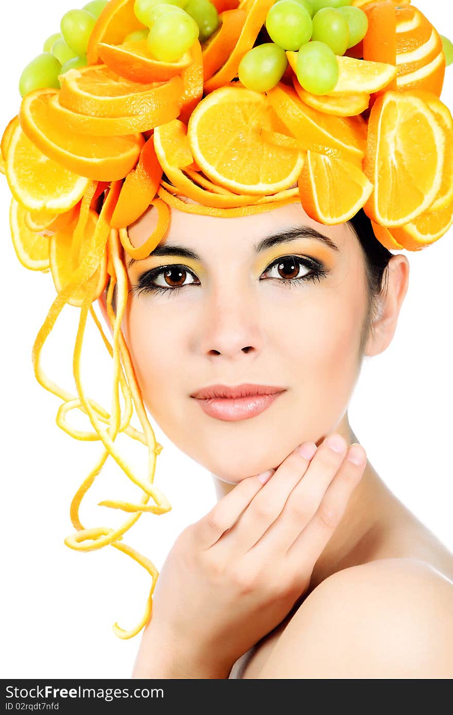 Shot of a beautiful young woman with fruits headwear. Food concept, healthcare. Shot of a beautiful young woman with fruits headwear. Food concept, healthcare.