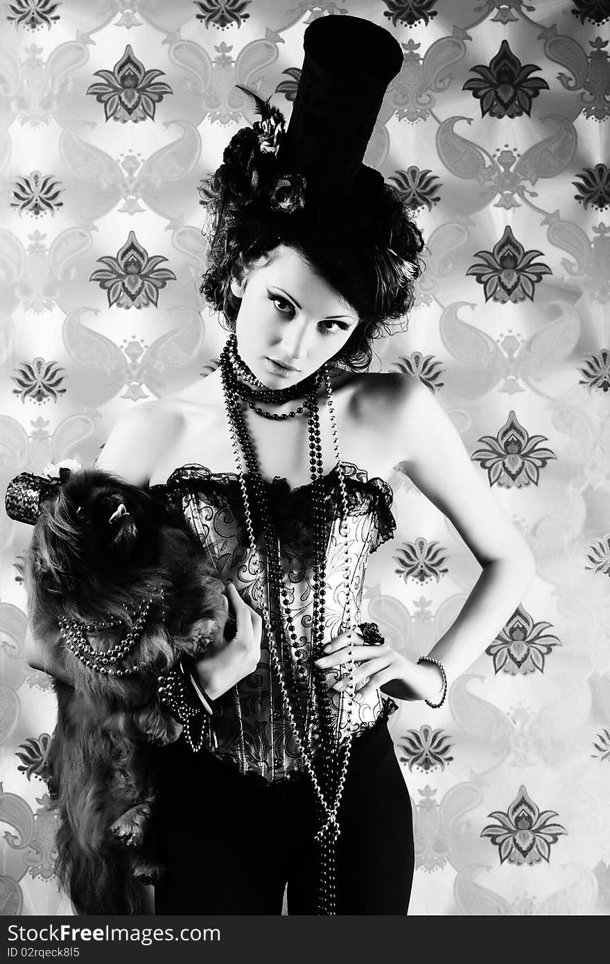 Portrait of a fashionable lady with a dog over vintage background.