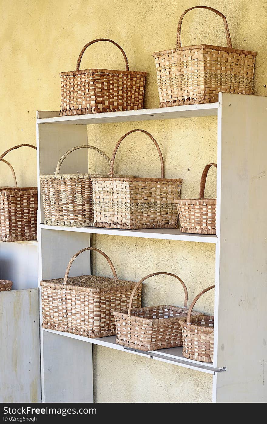 Shelves filled up with basket that is for sale. Shelves filled up with basket that is for sale