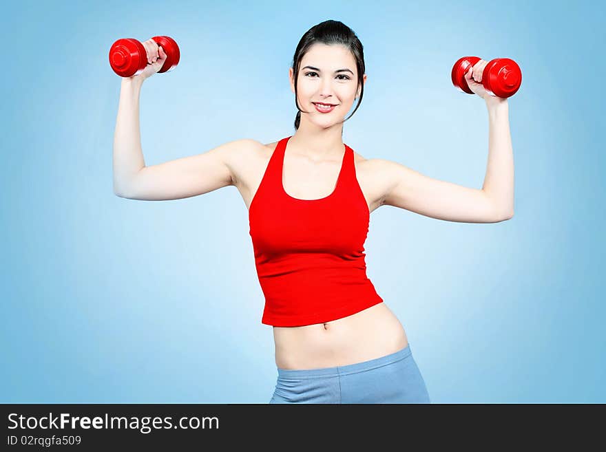 Girl with dumbbells