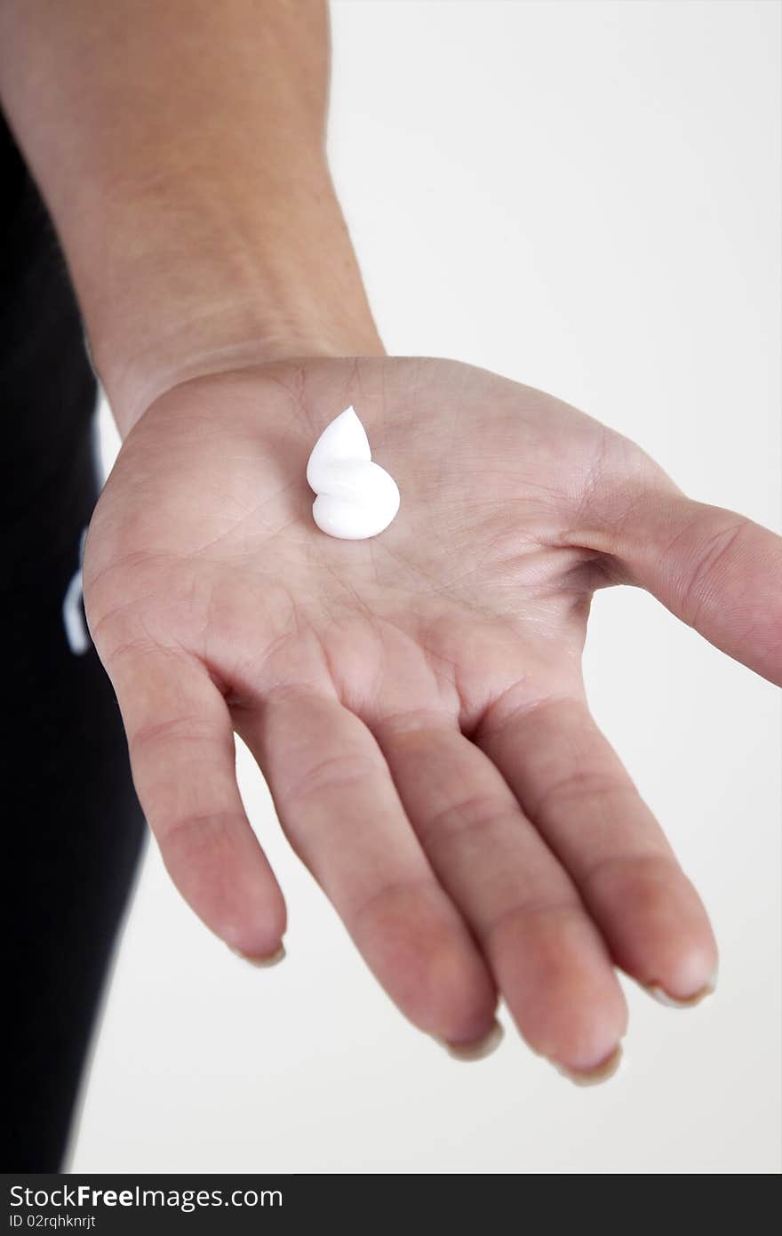 Woman applying moisturizing cream