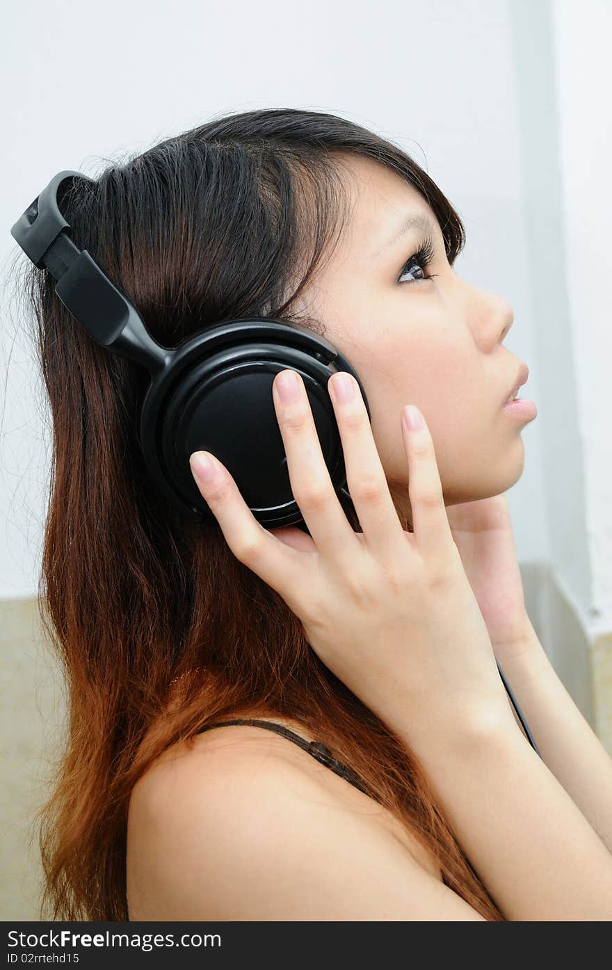 Female listening to music on headphones. Female listening to music on headphones