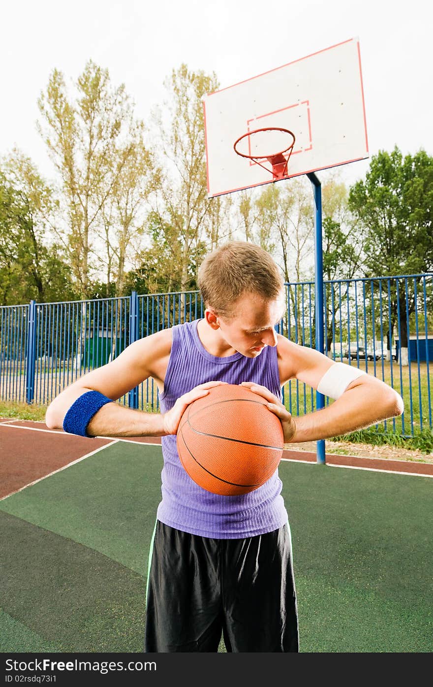 Young men playing street basketball. Young men playing street basketball