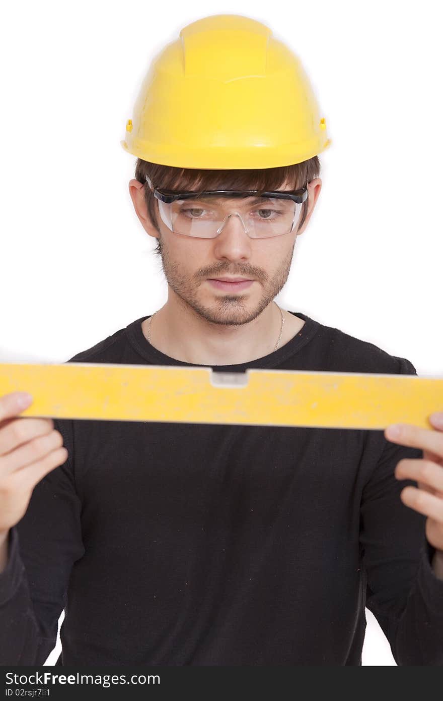 Manual worker with level on white background