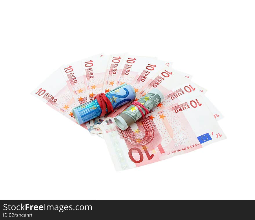 Ten euro banknotes fanned with five and twenty euro banknotes rolled on a white. Ten euro banknotes fanned with five and twenty euro banknotes rolled on a white