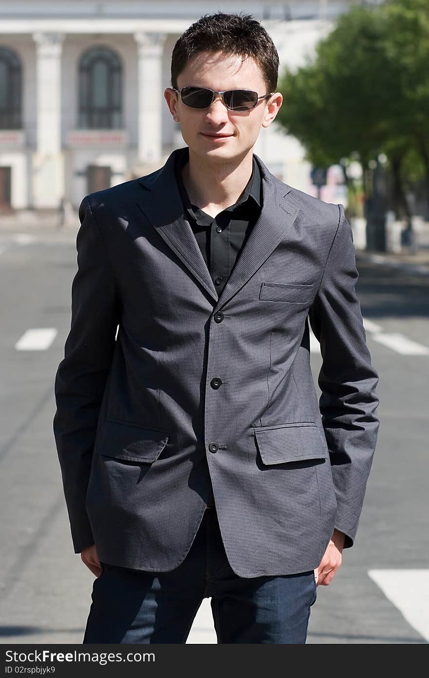 Young adult european man in black sunglasses