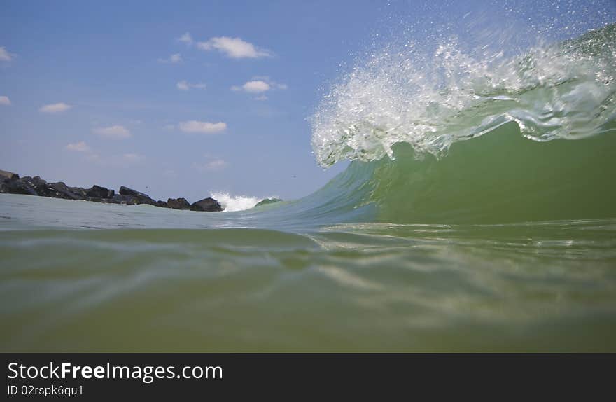 Wave crashing along beach in Atlantic