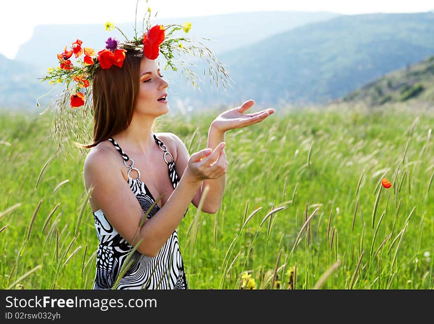 Woman and circlet of flowers