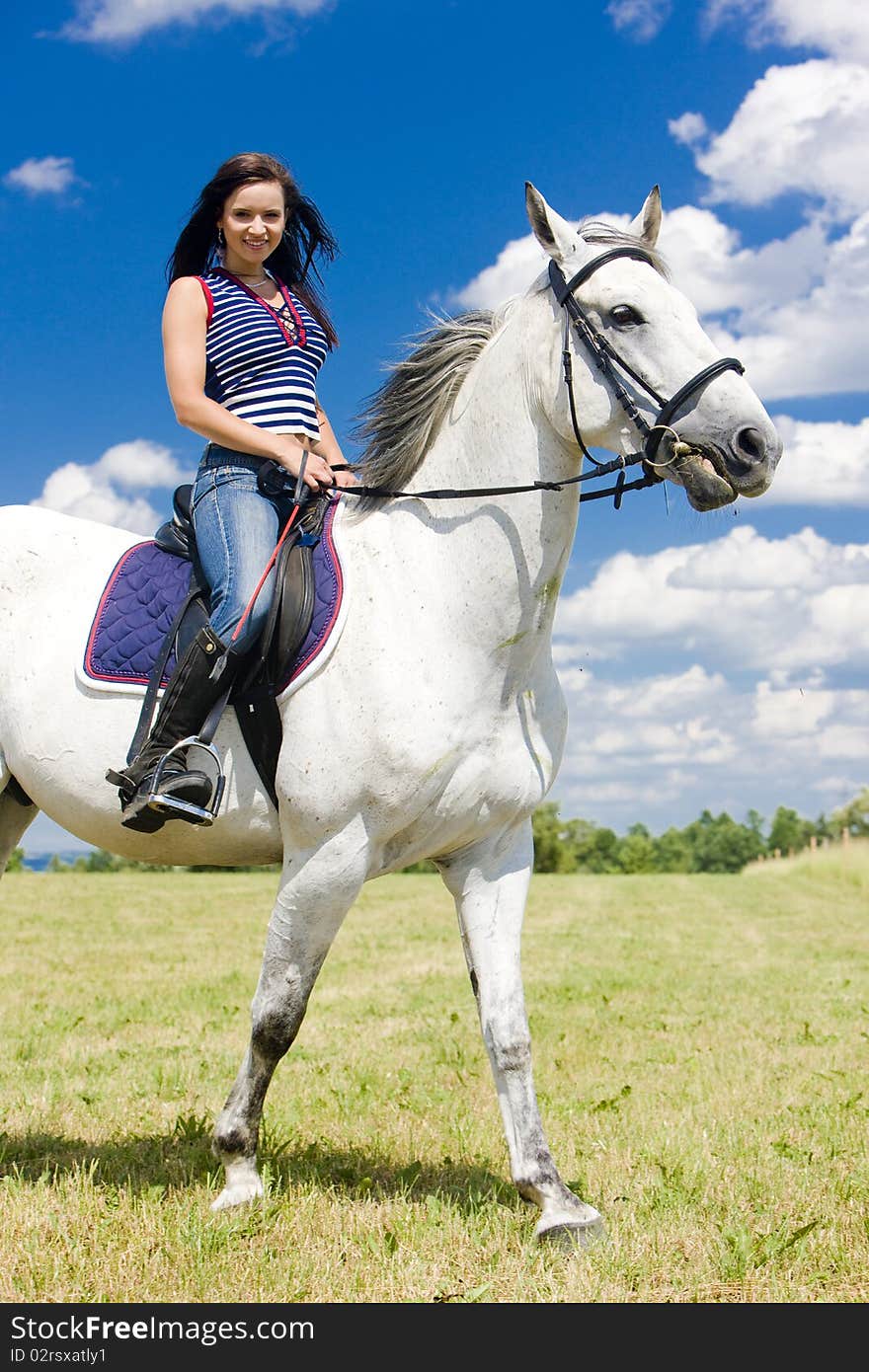 Young woman equestrian on horseback