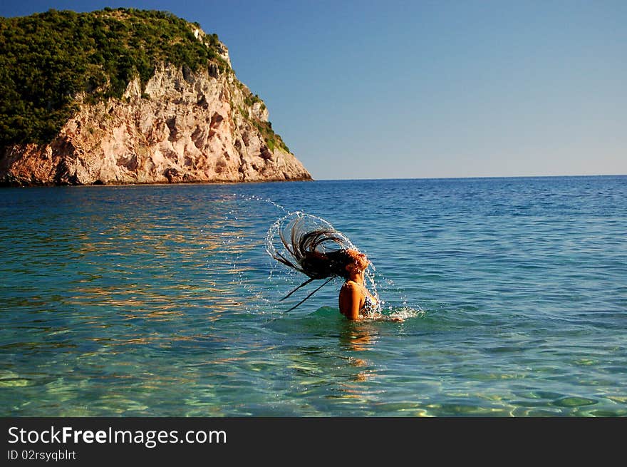 A girl having fun in Adriatic waters of Montenegro