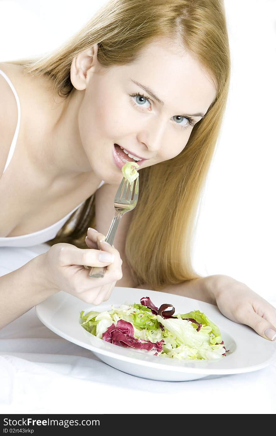 Woman eating salad