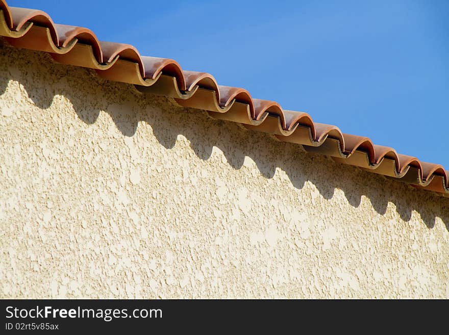 Roof with red tiles and blue skies