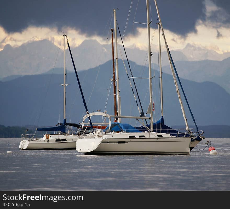 Some sail boats just before a heavy thunderstorm on Lake Starnberg (Germany), one of the Bavarian Lakes. The Alps are in the back.