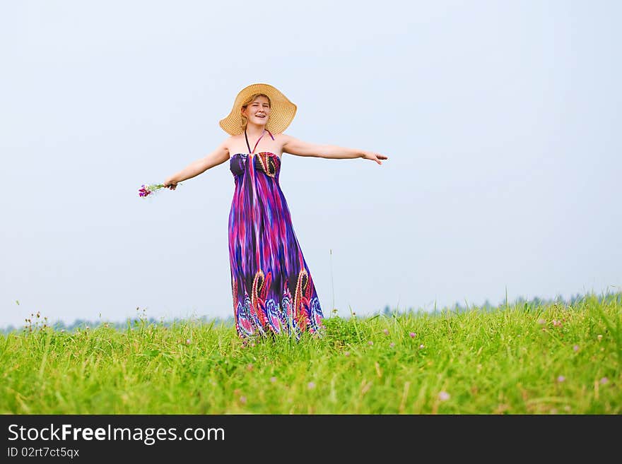 Young beautiful girl on a meadow