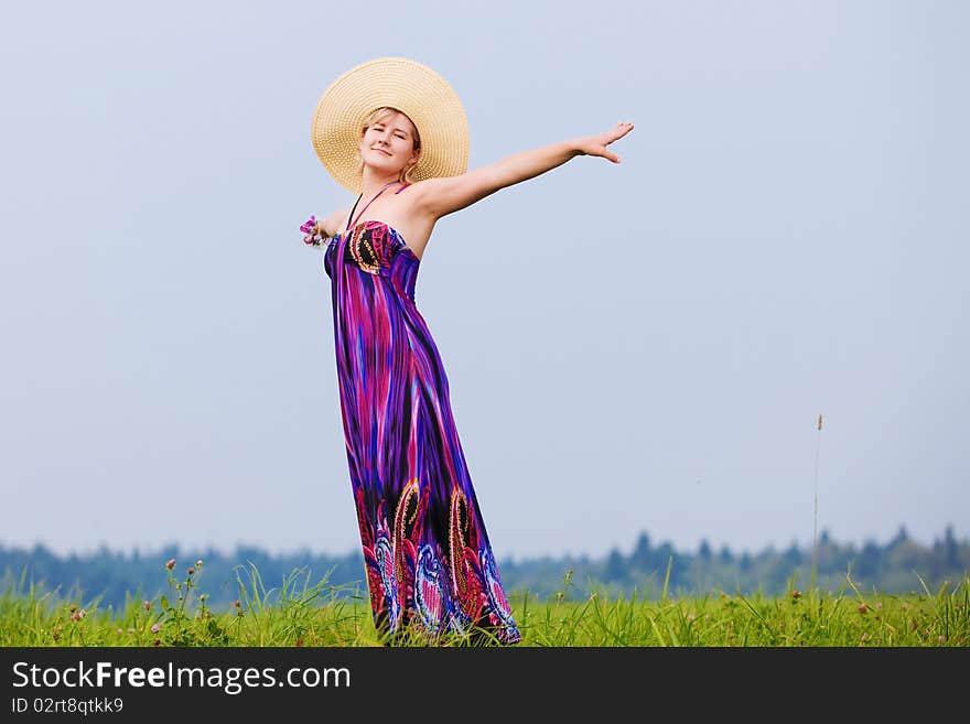 Young beautiful girl on a meadow