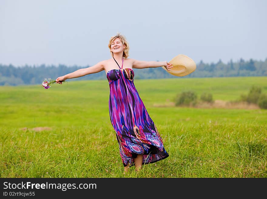 Young beautiful girl on a meadow