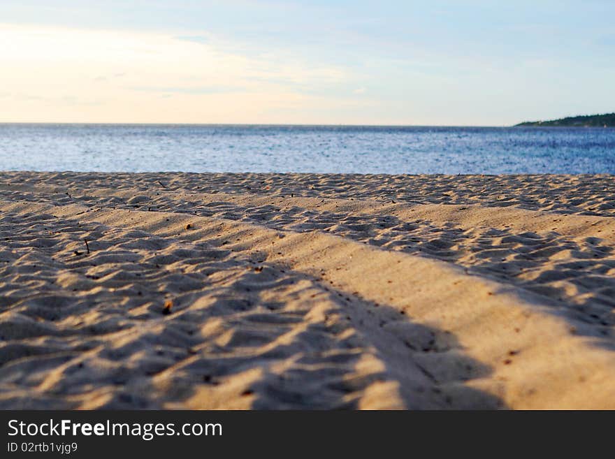 Background with sand, sea and blue sky. Background with sand, sea and blue sky