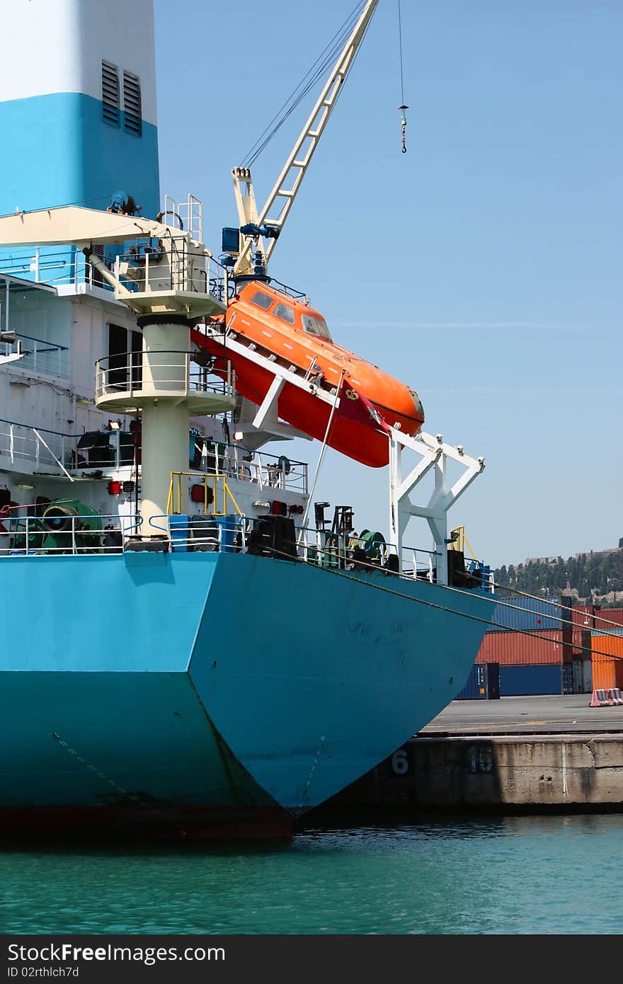 Big lift on industrial shipping boat in port. Big lift on industrial shipping boat in port