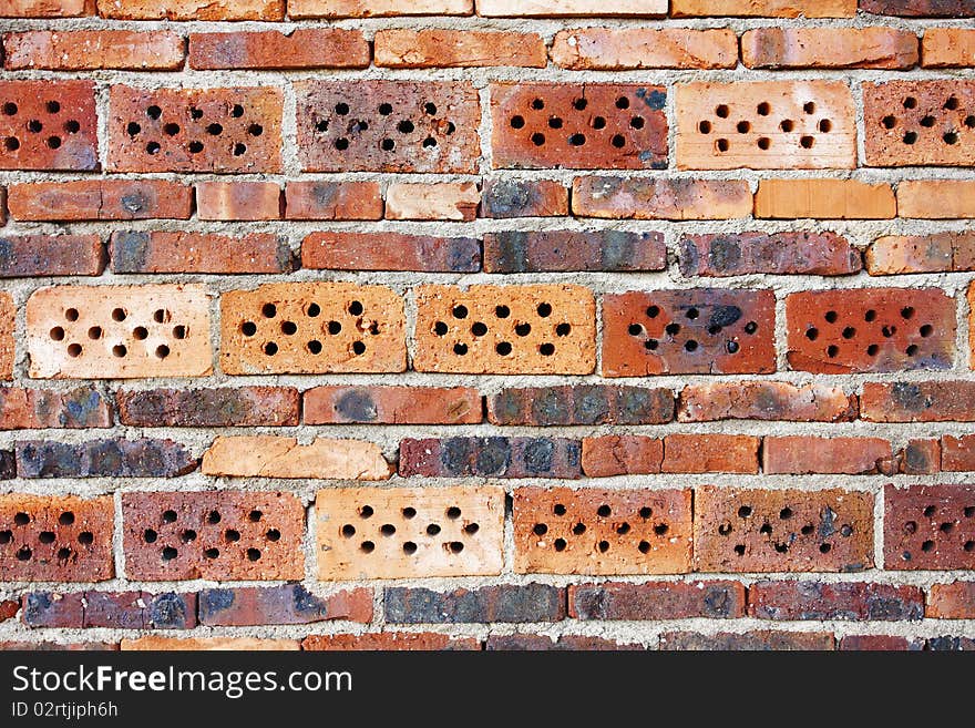 Weathered stained old red brick wall background