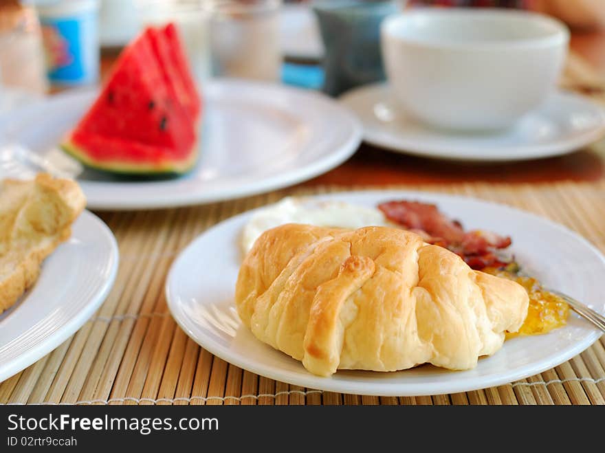 Tea and croissants on the table .