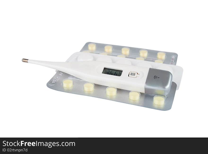 Medical thermometer and pills on a white background