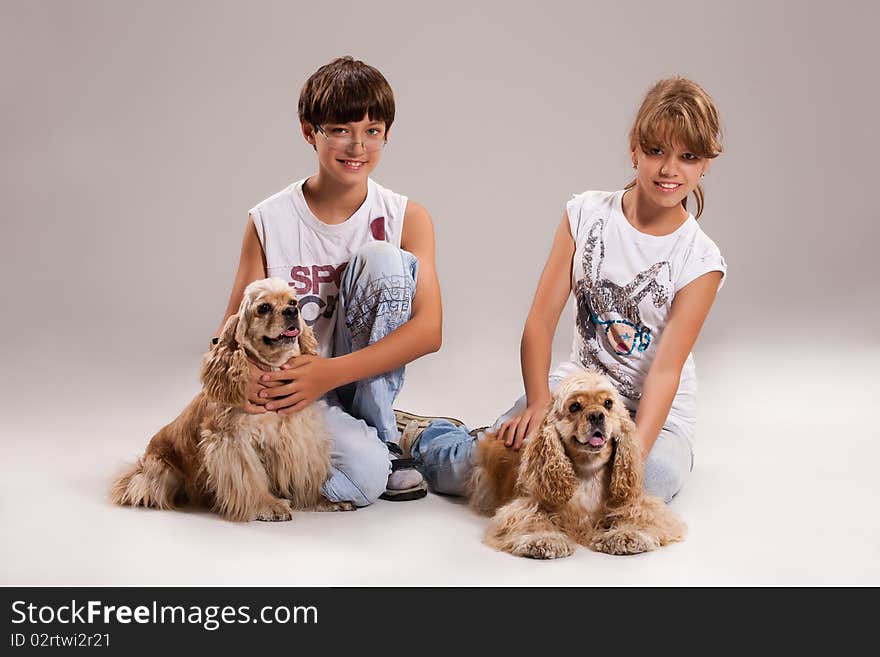 Boy and girl with dogs on isolated background. Boy and girl with dogs on isolated background